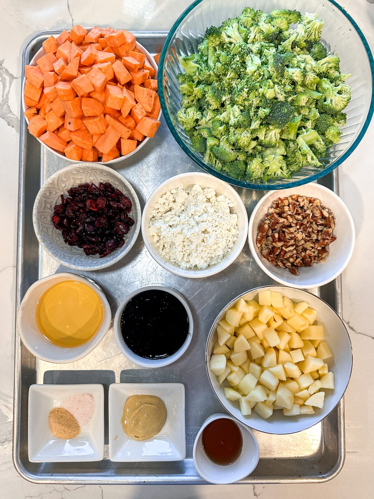 A perfect fall-inspired salad featuring roasted sweet potatoes, crunchy broccoli, and a tangy, creamy maple balsamic dressing.