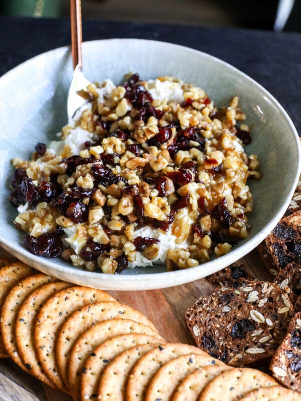 Indulge in this creamy, sweet & savory whipped goat cheese dip! Topped with a warm honey, cranberry, and walnut crunch.