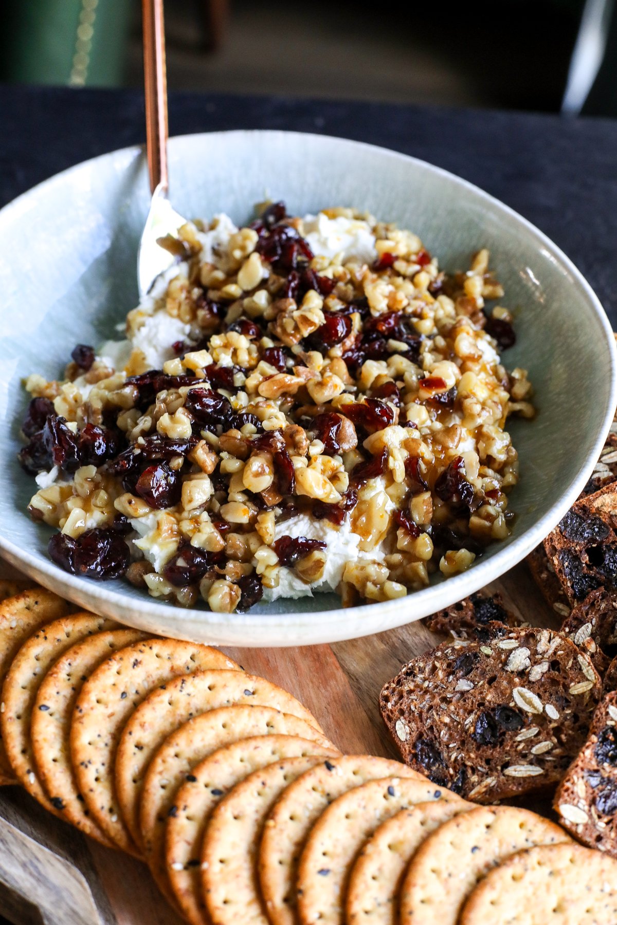 Indulge in this creamy, sweet & savory whipped goat cheese dip! Topped with a warm honey, cranberry, and walnut crunch.