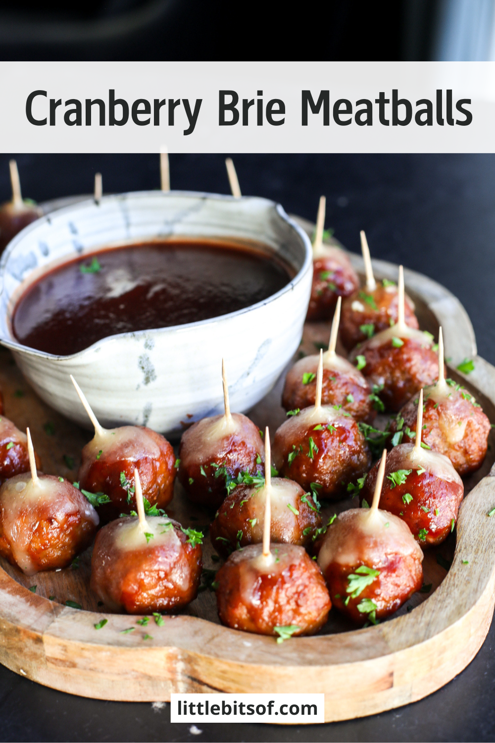 Holiday perfection: Cranberry, BBQ, and savory meatballs baked with a creamy slice of melted brie cheese.