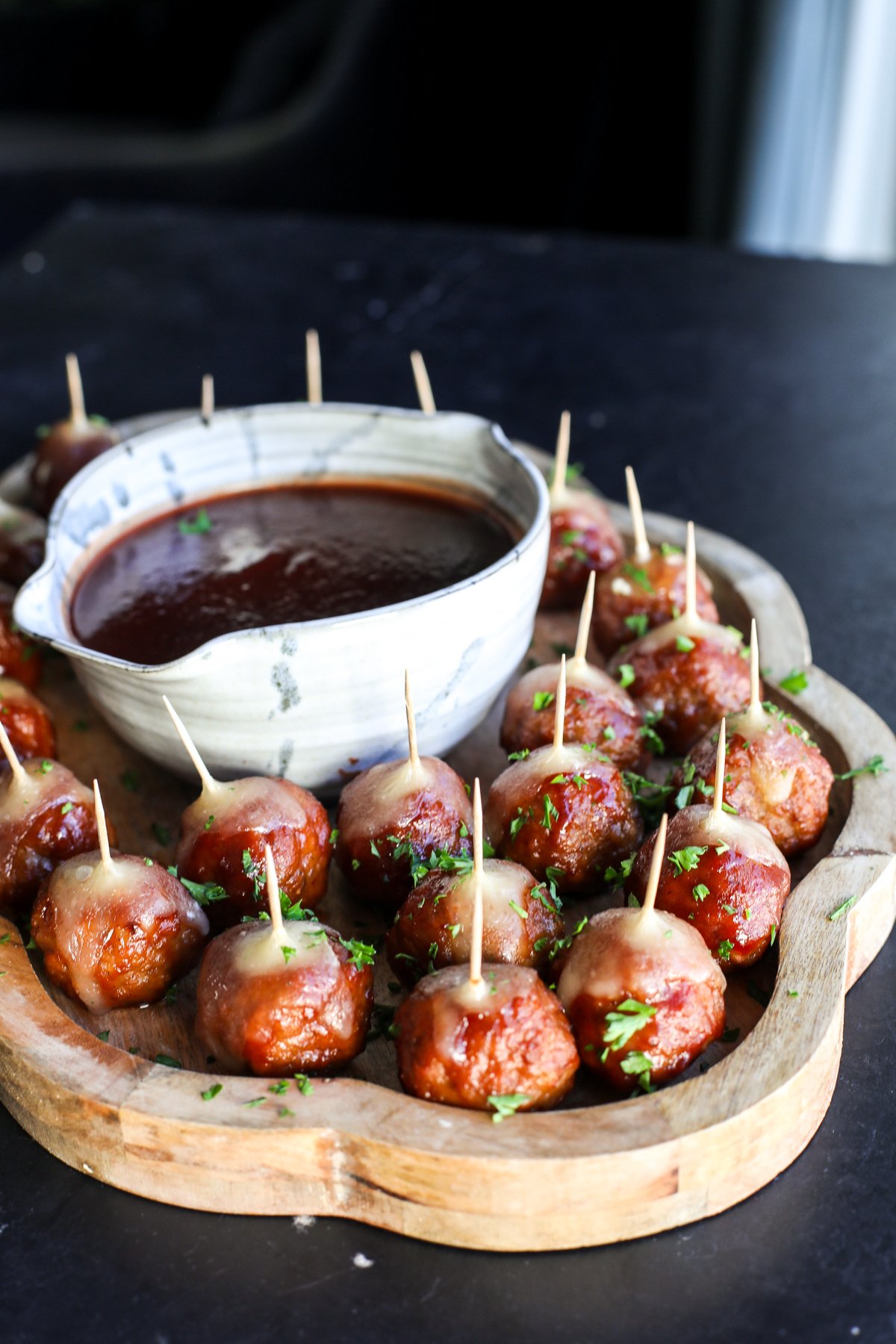 Holiday perfection: Cranberry, BBQ, and savory meatballs baked with a creamy slice of melted brie cheese.