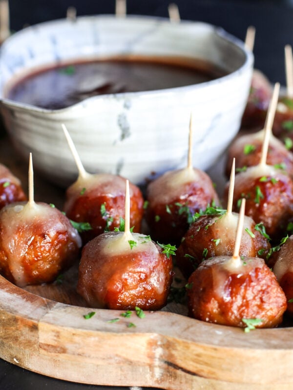 Holiday perfection: Cranberry, BBQ, and savory meatballs baked with a creamy slice of melted brie cheese.