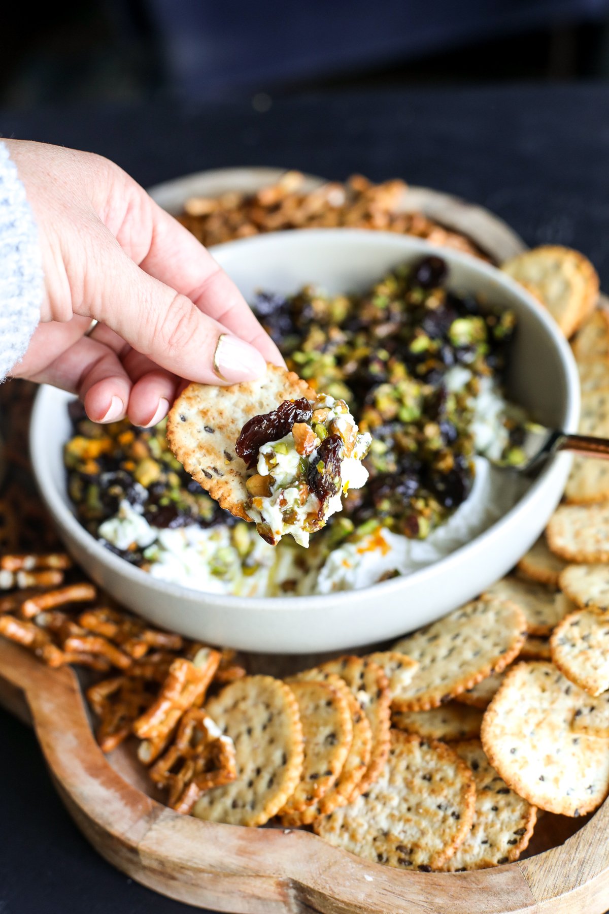 Sweet, savory, and perfect for a party! Whipped goat cheese topped with warm honey-glazed pistachios and dried cherries.