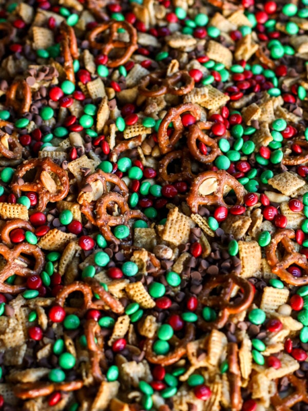 This crunchy, sweet Christmas Crack Chex Mix is addictive! An easy holiday recipe with buttery toffee, pretzels, and M&Ms.