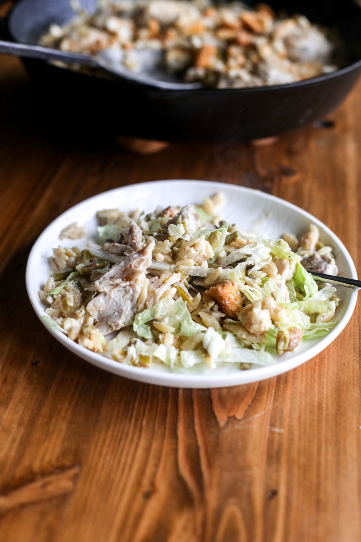 Turn Caesar salad into a cozy one-pan meal! Tender chicken, orzo, and asparagus in a creamy, savory dressing sauce.