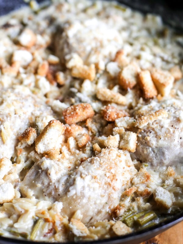 Turn Caesar salad into a cozy one-pan meal! Tender chicken, orzo, and asparagus in a creamy, savory dressing sauce.