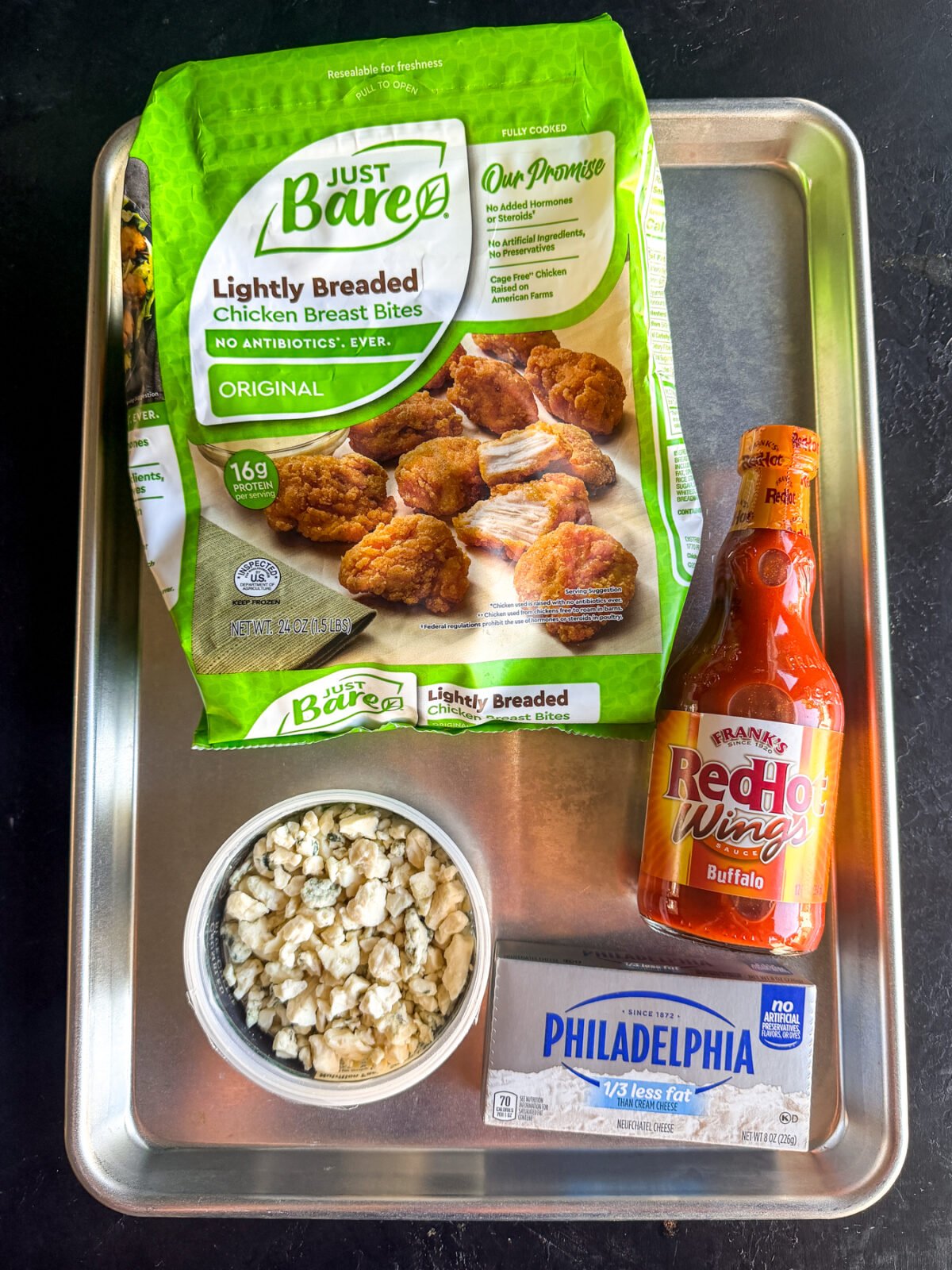 The ultimate game day dip! Creamy whipped blue cheese topped with crispy buffalo chicken nuggets. Quick and easy.