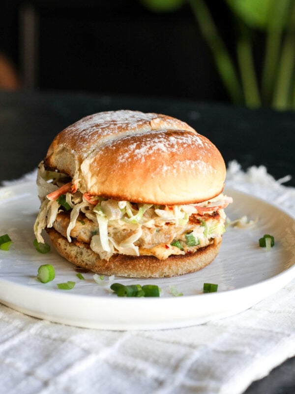 The ultimate fusion burger! Ginger-garlic chicken patties with a zesty Kewpie slaw and a kick of spicy chili crunch.