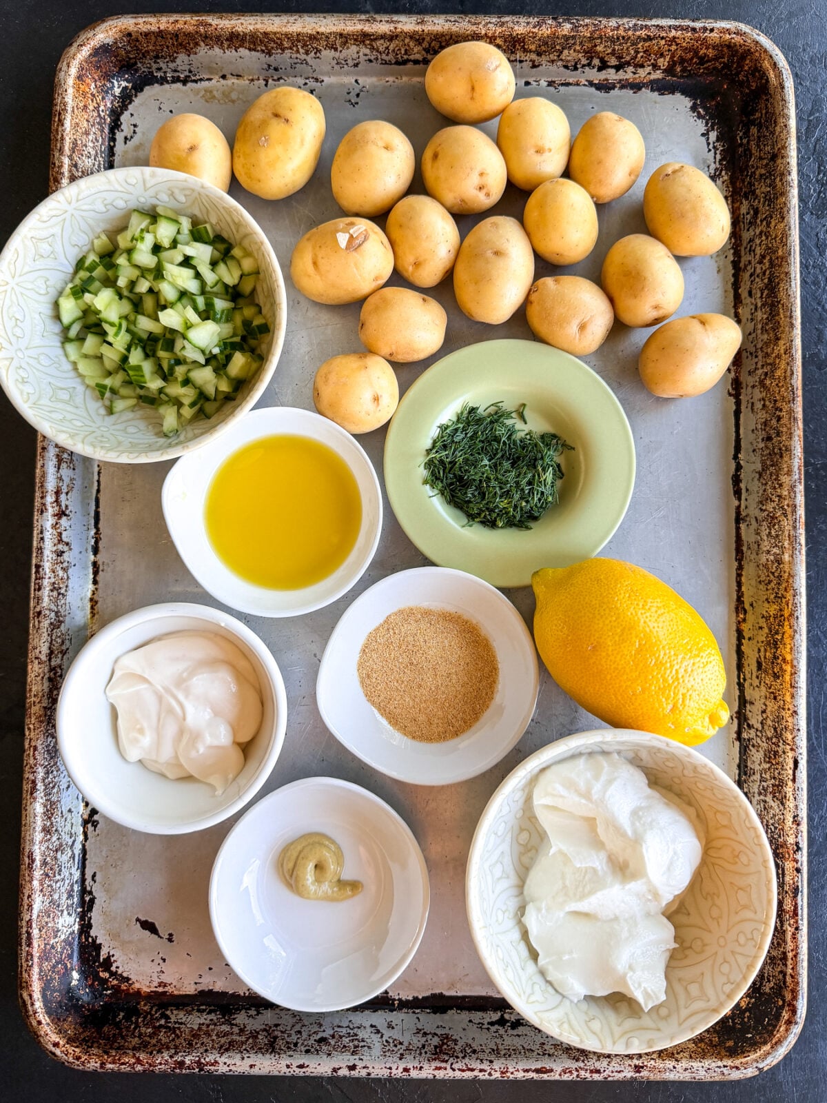 Crispy potatoes meet a creamy cucumber dill sauce. This easy, healthy side features roasted gold potatoes over a refreshing Greek yogurt dressing.