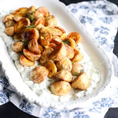 Crispy potatoes meet a creamy cucumber dill sauce. This easy, healthy side features roasted gold potatoes over a refreshing Greek yogurt dressing.