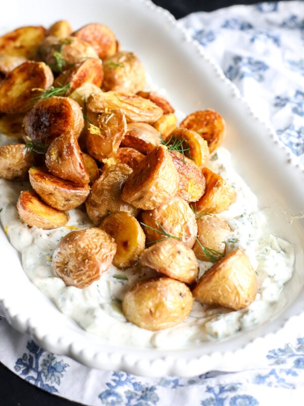 Crispy potatoes meet a creamy cucumber dill sauce. This easy, healthy side features roasted gold potatoes over a refreshing Greek yogurt dressing.