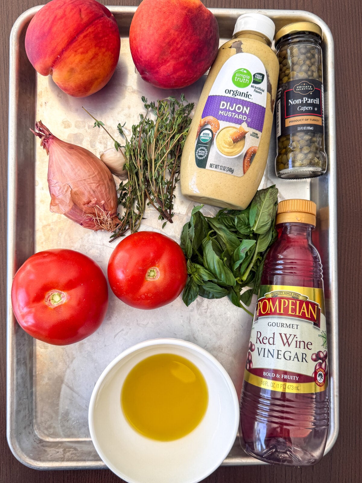 Fresh peach tomato bruschetta with basil and a tangy vinaigrette. An easy make-ahead appetizer for summer gatherings.