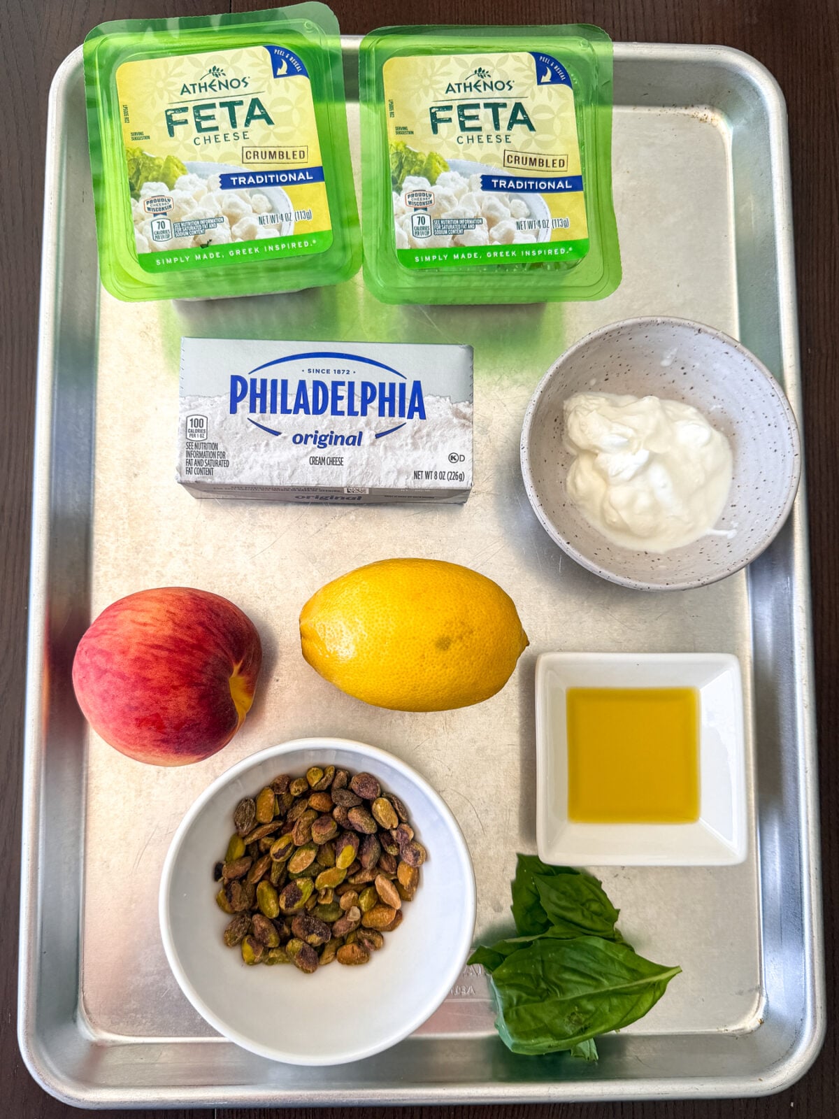 Creamy whipped feta topped with fresh peaches, pistachios, and hot honey makes an easy, crowd-pleasing summer appetizer.