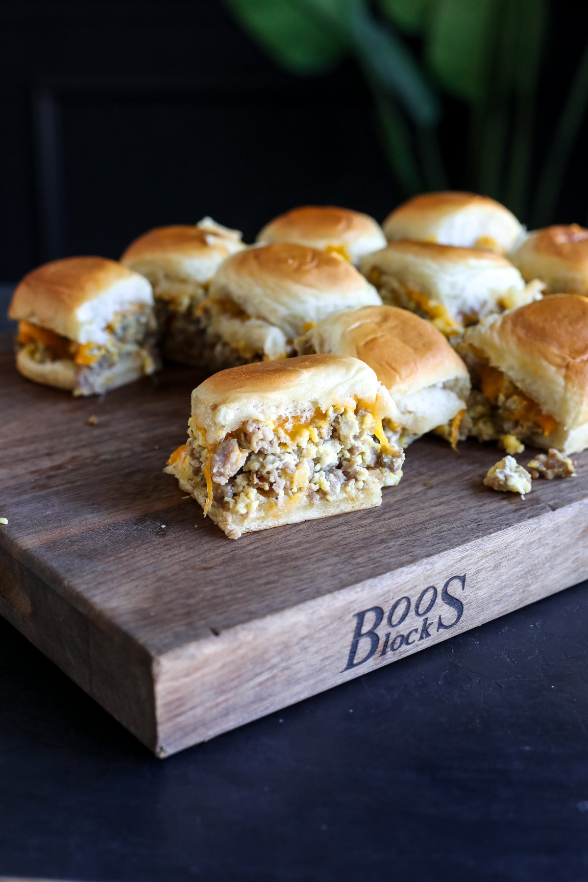 Easy sausage breakfast sliders made with eggs, cheddar cheese, and maple butter on Hawaiian rolls. A crowd-pleasing brunch recipe.