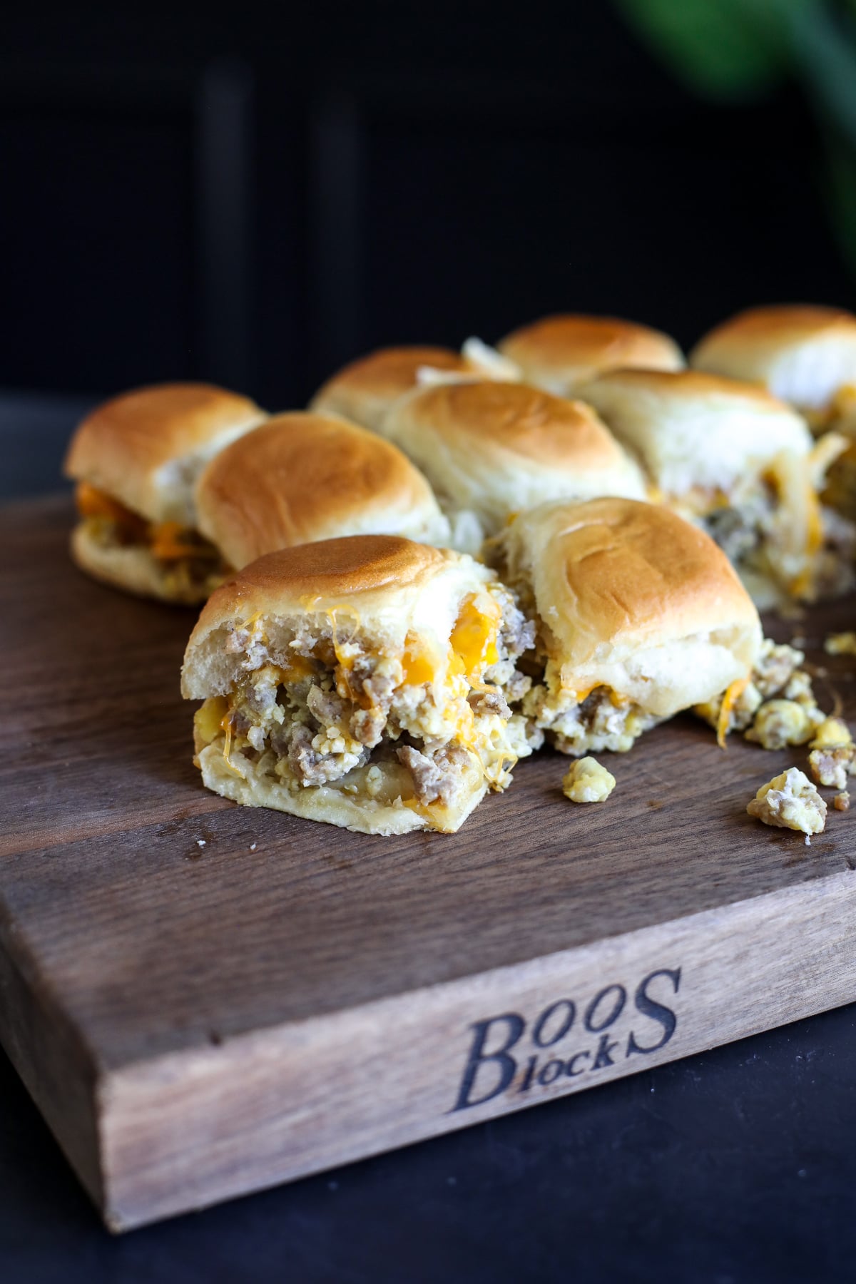Easy sausage breakfast sliders made with eggs, cheddar cheese, and maple butter on Hawaiian rolls. A crowd-pleasing brunch recipe.