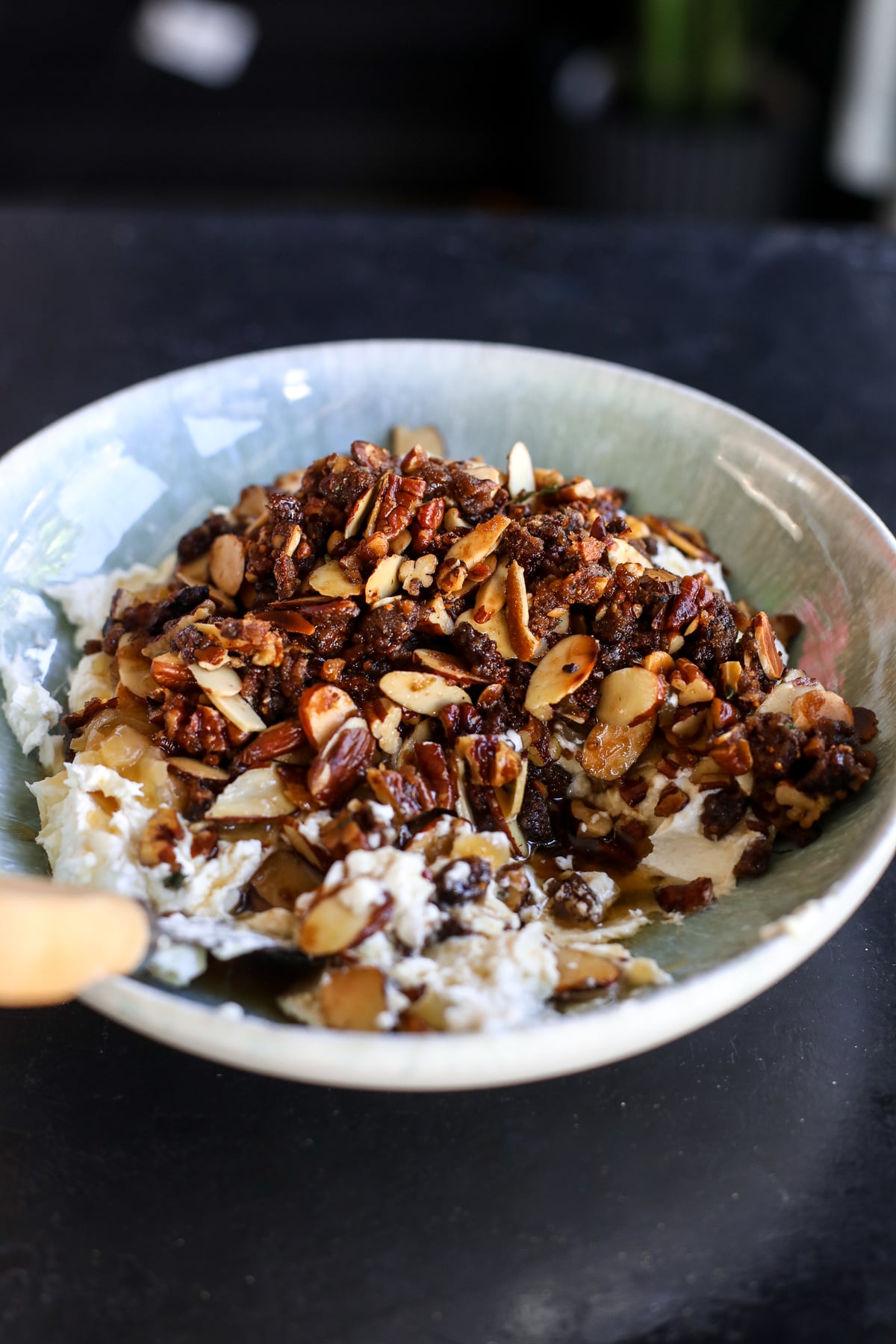 Creamy whipped goat cheese topped with caramelized onion jam, candied pecans, almonds, figs and hot honey. An easy, impressive holiday appetizer!