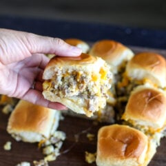Easy sausage breakfast sliders made with eggs, cheddar cheese, and maple butter on Hawaiian rolls. A crowd-pleasing brunch recipe.