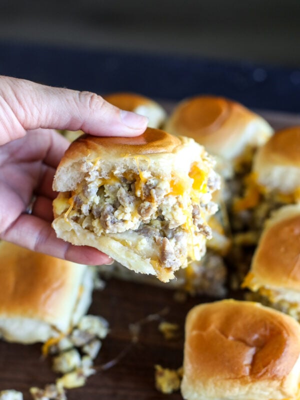 Easy sausage breakfast sliders made with eggs, cheddar cheese, and maple butter on Hawaiian rolls. A crowd-pleasing brunch recipe.