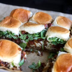 Office Burger Sliders loaded with bacon onion jam, Gruyère, blue cheese and arugula for an easy, flavor-packed twist on the iconic burger.