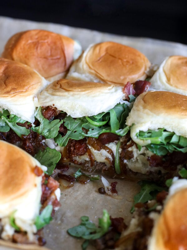 Office Burger Sliders loaded with bacon onion jam, Gruyère, blue cheese and arugula for an easy, flavor-packed twist on the iconic burger.