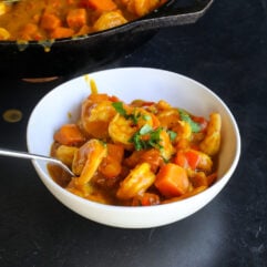 This Coconut Sweet Potato Shrimp Curry is a creamy, cozy one-pan dinner packed with shrimp, sweet potatoes and veggies in a flavorful coconut curry sauce.
