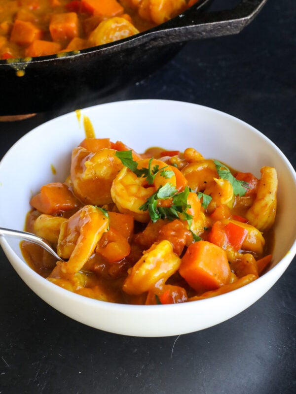 This Coconut Sweet Potato Shrimp Curry is a creamy, cozy one-pan dinner packed with shrimp, sweet potatoes and veggies in a flavorful coconut curry sauce.