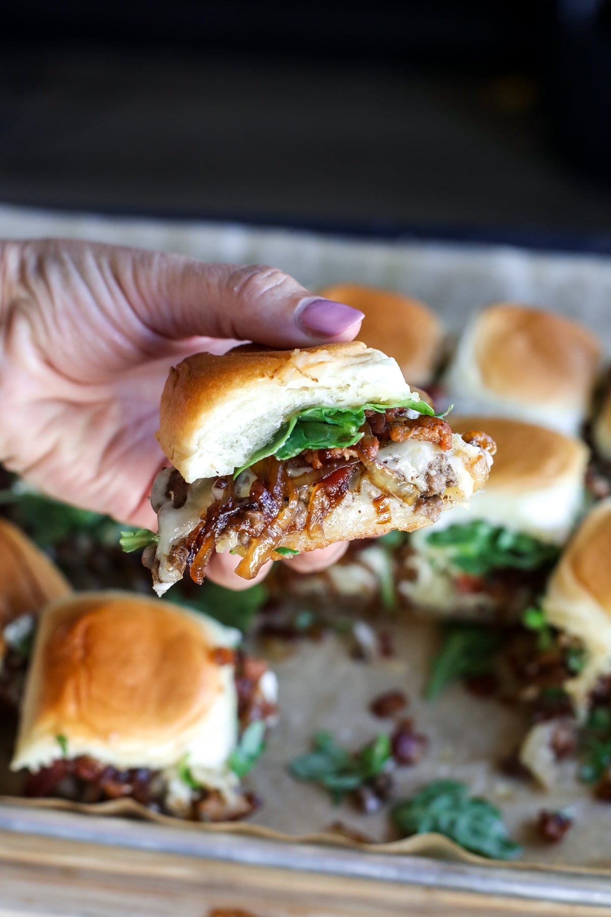 Office Burger Sliders loaded with bacon onion jam, Gruyère, blue cheese and arugula for an easy, flavor-packed twist on the iconic burger.