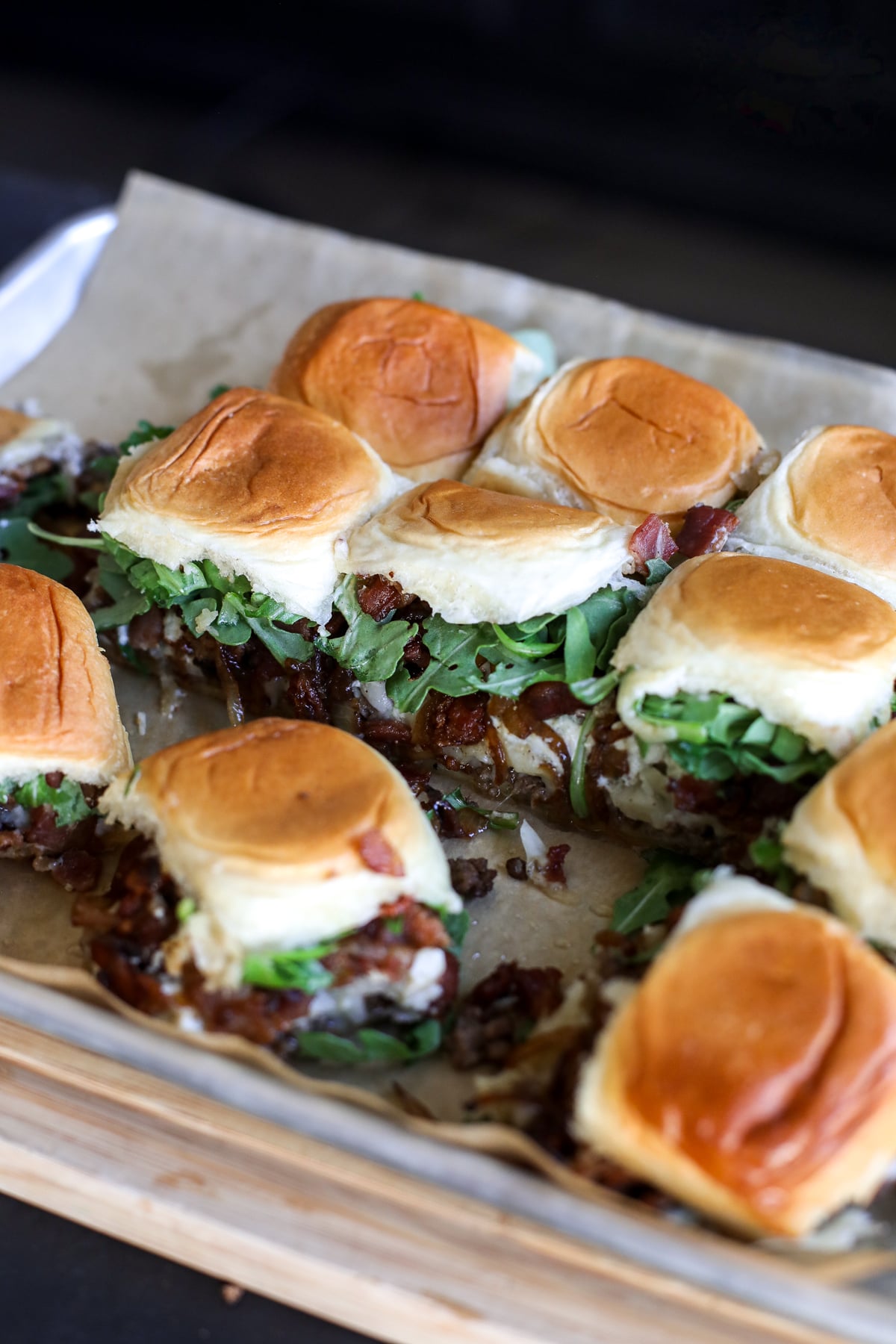 Office Burger Sliders loaded with bacon onion jam, Gruyère, blue cheese and arugula for an easy, flavor-packed twist on the iconic burger.