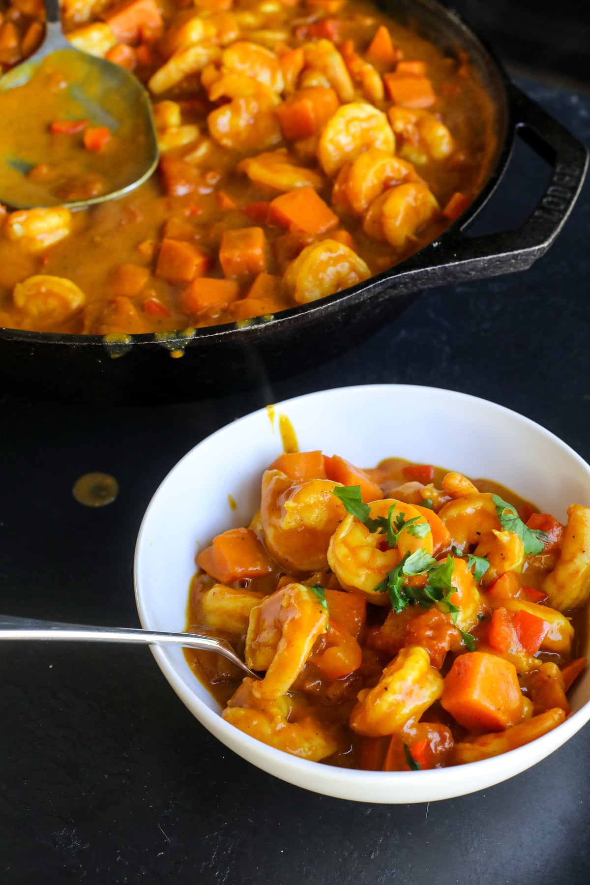 This Coconut Sweet Potato Shrimp Curry is a creamy, cozy one-pan dinner packed with shrimp, sweet potatoes and veggies in a flavorful coconut curry sauce.