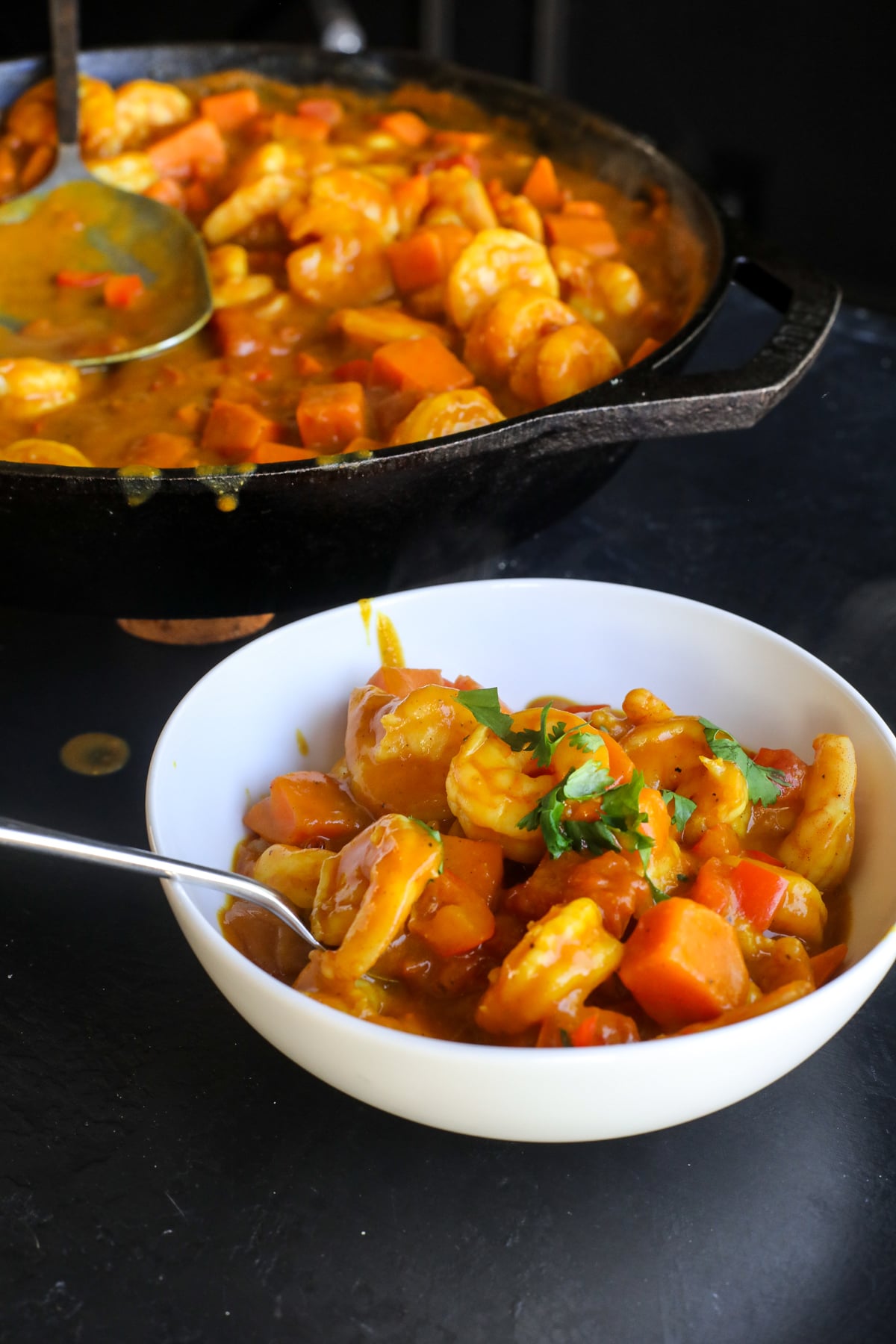 This Coconut Sweet Potato Shrimp Curry is a creamy, cozy one-pan dinner packed with shrimp, sweet potatoes and veggies in a flavorful coconut curry sauce.