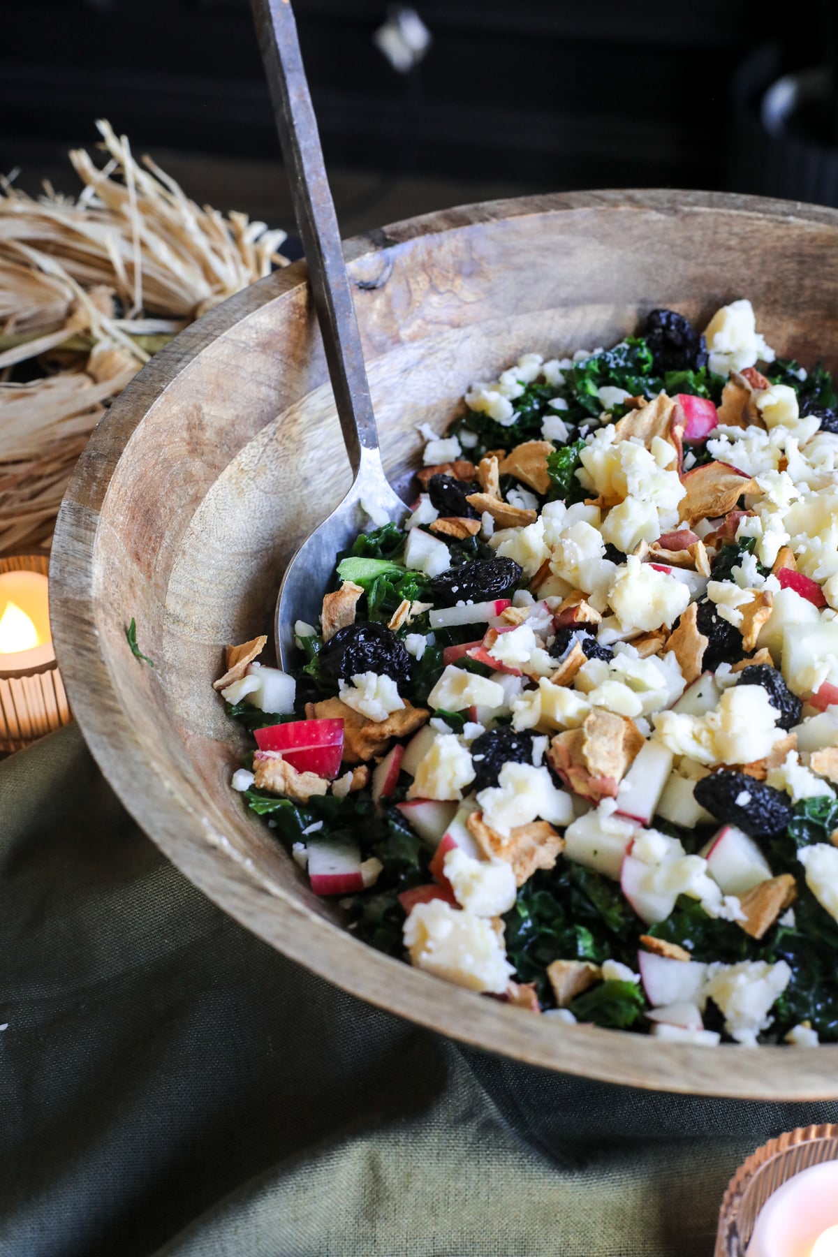 This Apple Kale Salad is loaded with crisp apples, sharp cheddar, pecans, dried cherries and apple chips, tossed in a homemade rosemary apple vinaigrette.