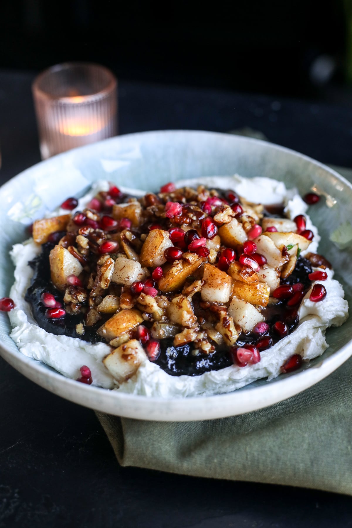 This Cranberry Pear Whipped Goat Cheese is the perfect holiday appetizer with creamy goat cheese, cranberry chutney, maple pecans, fresh pears and pomegranate!