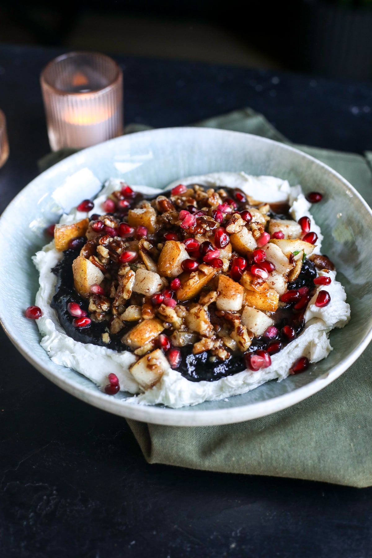 This Cranberry Pear Whipped Goat Cheese is the perfect holiday appetizer with creamy goat cheese, cranberry chutney, maple pecans, fresh pears and pomegranate!